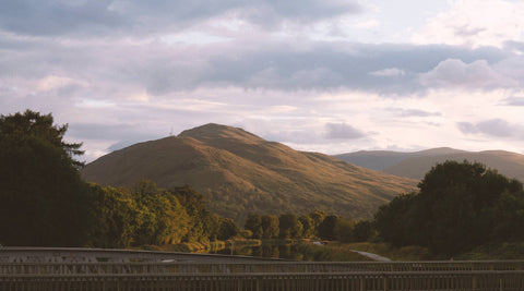 Mountain scenery at dusk, shot from a steel span bridge.