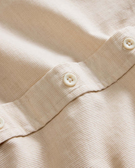 material shot of the buttons on The Jack in Oat Heathered Pincord, Wovens by Taylor Stitch