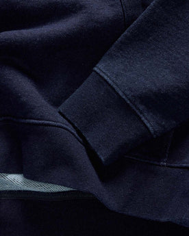 material shot of the hem on The Apres Quarter Zip in Rinsed Indigo Terry, Knits by Taylor Stitch