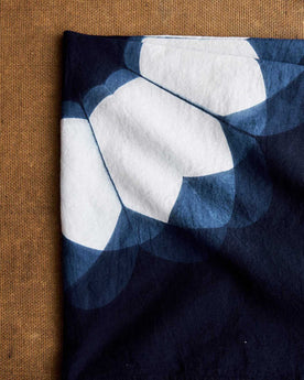 editorial image of The Hand Dyed Bandana in Indigo Sunflower folded, Accessories by Taylor Stitch