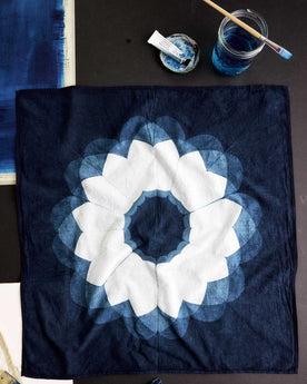 editorial flatlay of The Hand Dyed Bandana in Indigo Sunflower next to other objects, Accessories by Taylor Stitch