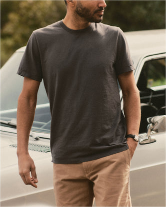 fit model posing in The Cotton Hemp Tee in Faded Black