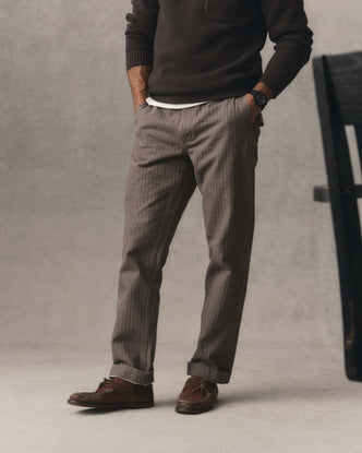 fit model posing in The Emlen Pant in Smoked Olive Herringbone