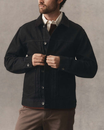 fit model showing off the buttons on The Ryder Jacket in Rinsed Black Organic Selvedge
