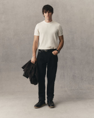 fit model posing in The Democratic Jean in Rinsed Black Organic Selvedge