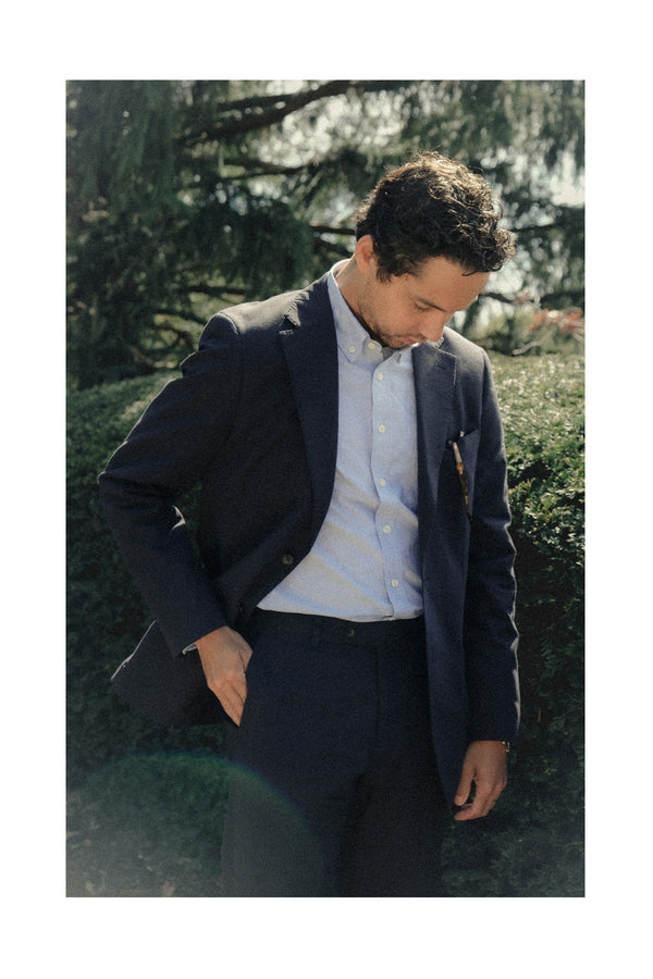 fit model posing in The Stevens Suit in Navy Linen