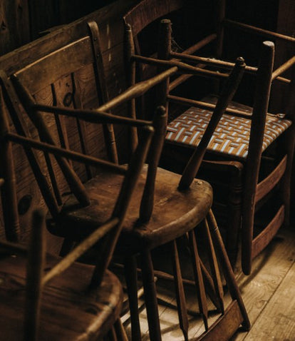 Wooden chairs stacked at Springhill Farm