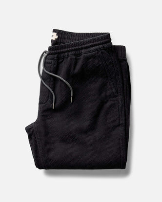 folded flatlay of The Apres Pant in Black Indigo Sashiko