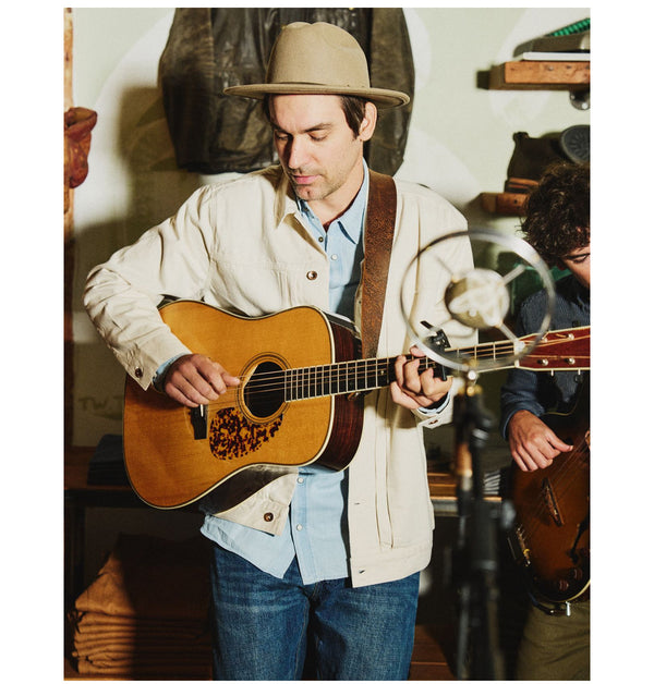 portrait of Daniel Rodriguez Playing Guitar