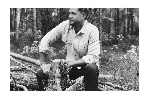 Brandon in the woods behind his future family home.