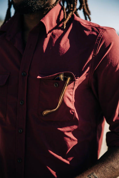 Close up shot of a pocket on a red shirt.