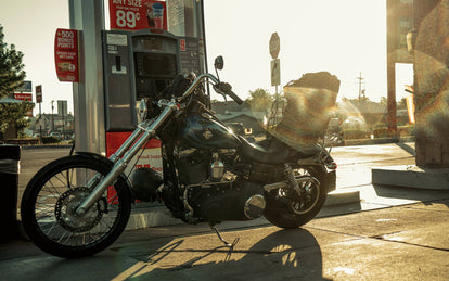 shot of bike at gas station.