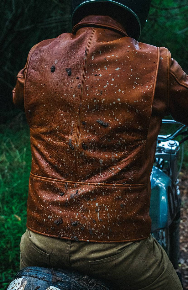 A wall clock with keys hanging underneath.