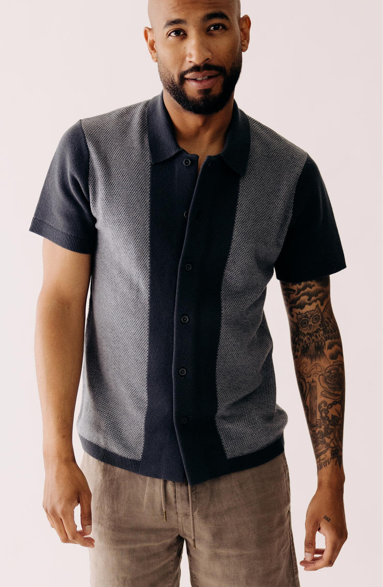 fit model standing wearing The Button Down Polo in Marine Seed Stitch