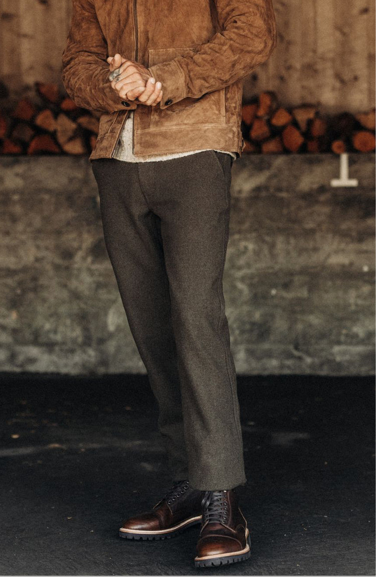 Model wearing The Carnegie Pant in Army Herringbone Wool