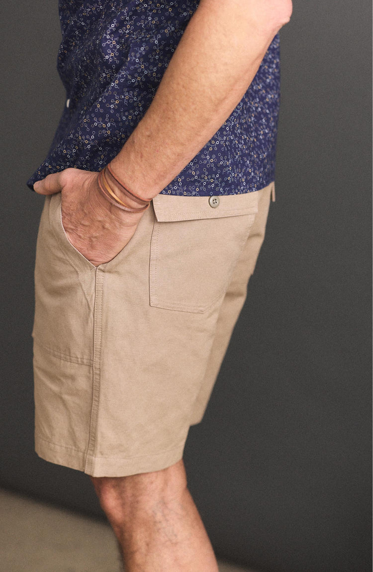 fit model with his hand in his pocket wearing The Apres Trail Short in Dried Earth Slub