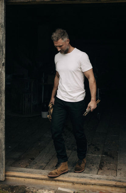fit model walking wearing The Organic Cotton Tee in Vintage White