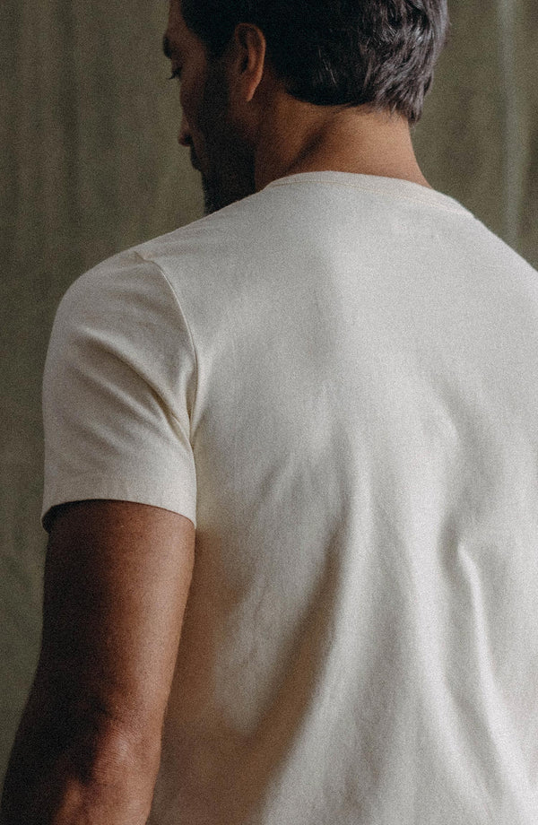 fit model walking wearing The Organic Cotton Tee in Vintage White