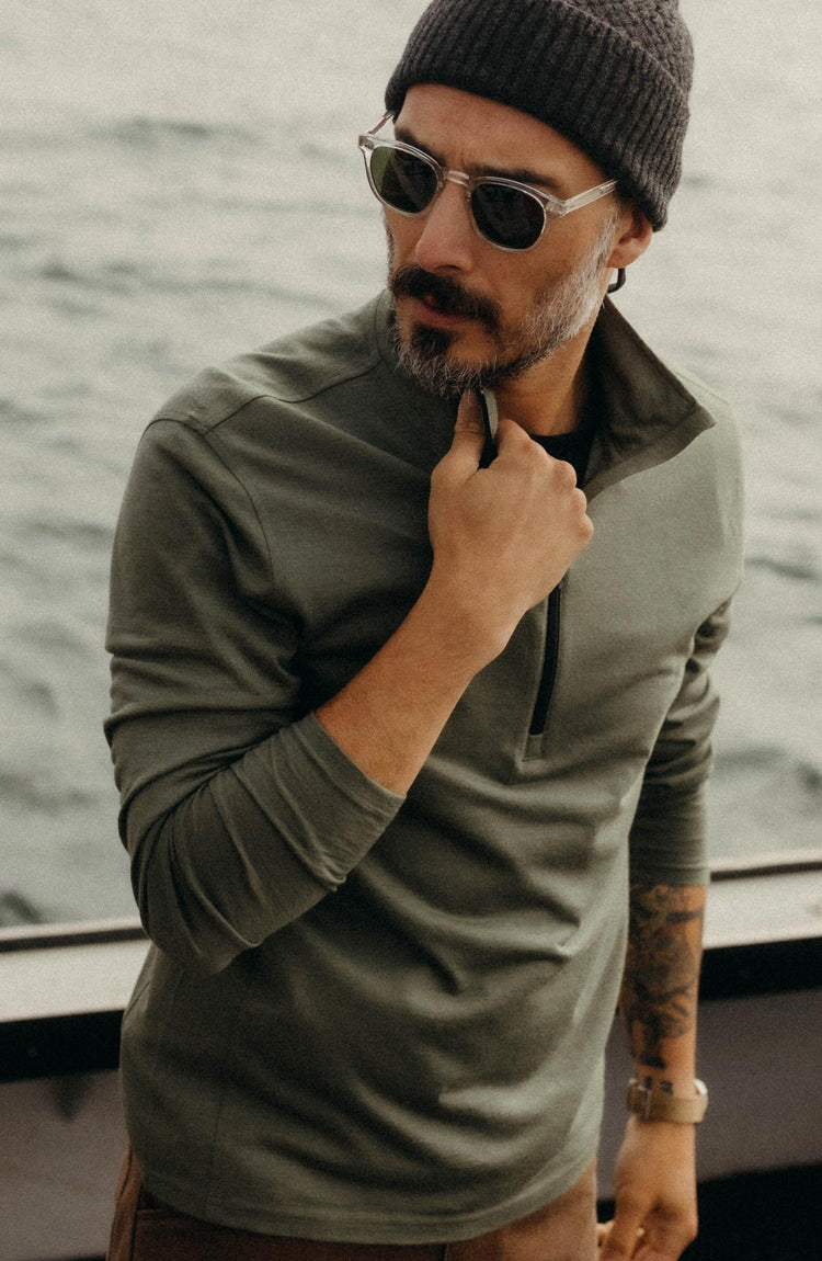 fit model posing in The Ridgeline Half Zip in Fatigue Olive