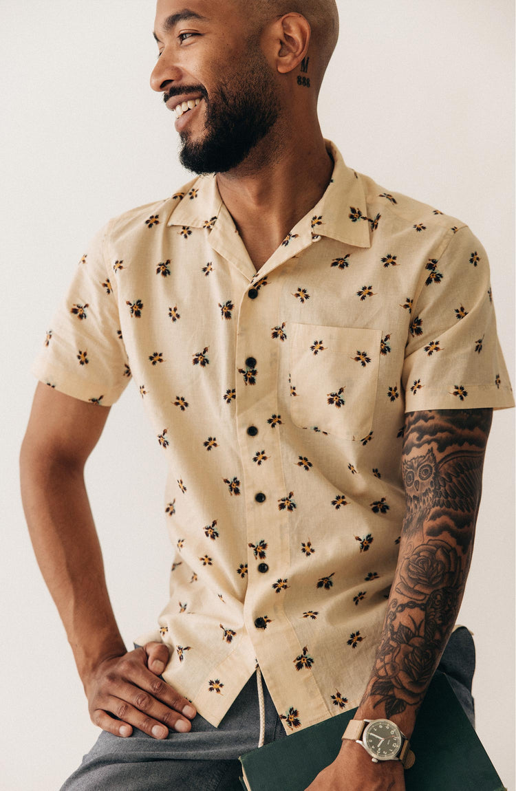 fit model sitting wearing The Short Sleeve Hawthorne in Almond Floral
