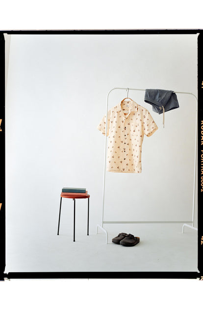 editorial image of The Short Sleeve Hawthorne in Almond Floral hanging on a rack