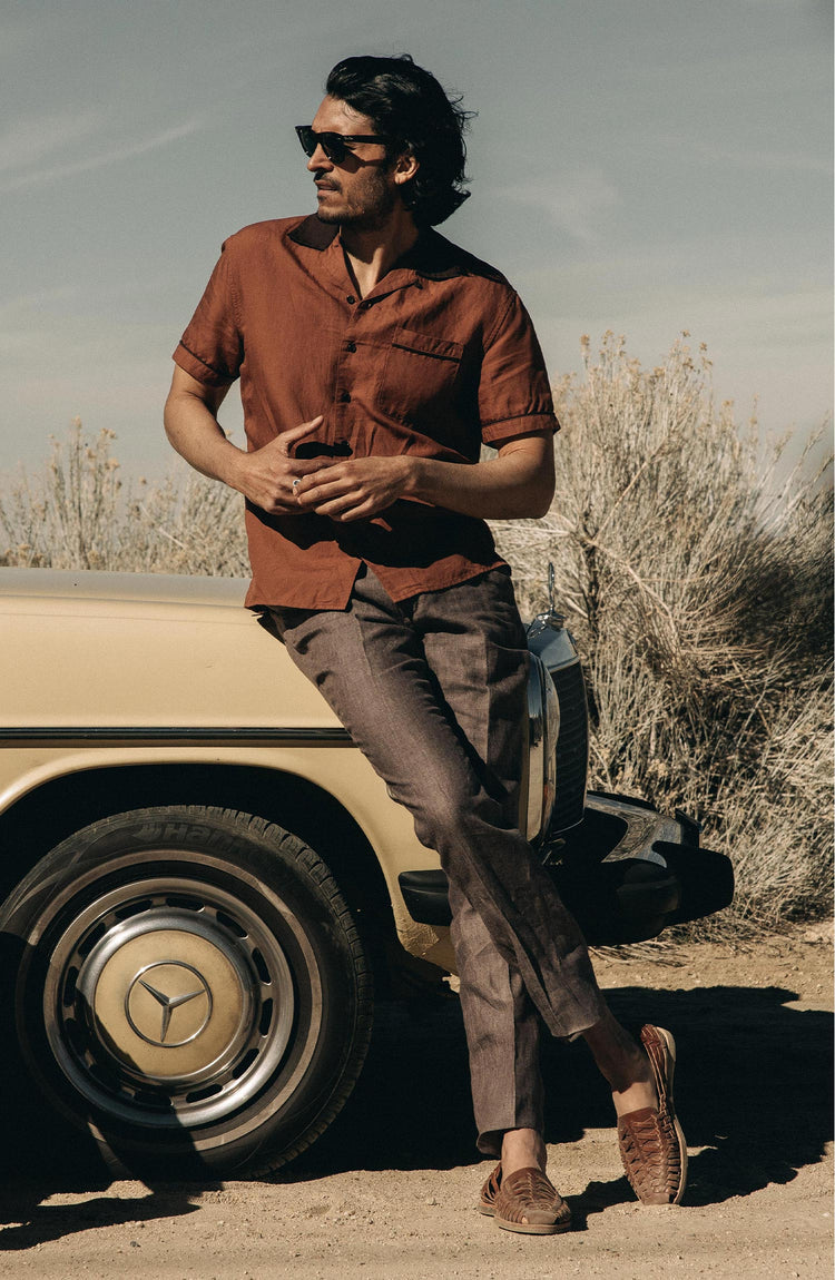Models posing by a vintage mercedes in the desert