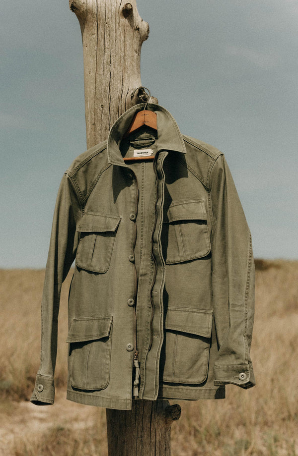 editorial image of The Surplus Jacket in Field Olive Reverse Sateen hanging