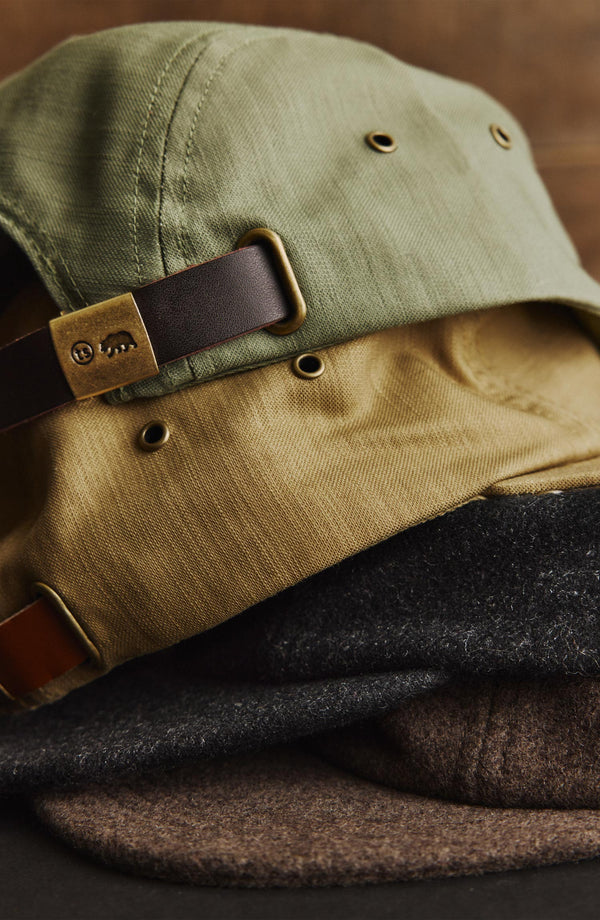 editorial image of The 5-Panel Cap in Khaki Reverse Sateen next to other caps