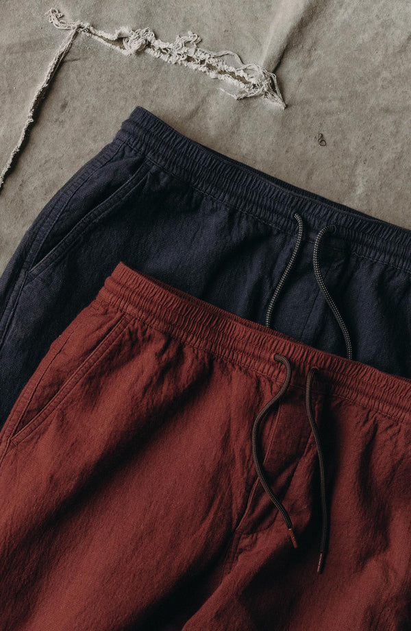 editorial flatlay of The Apres Pant in Burgundy Double Cloth