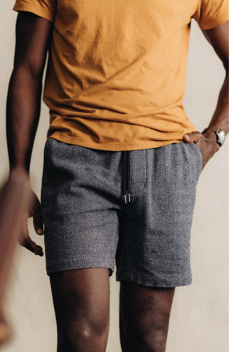 fit model posing in The Apres Short in Navy Linen Tweed