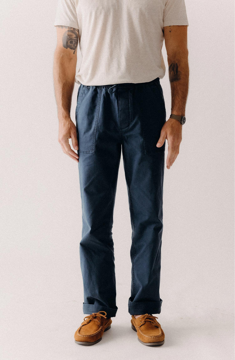 fit model posing in The Breakwater Pant in Dark Navy Ripstop