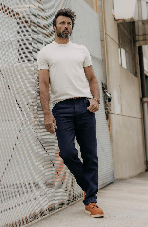 fit model with his hand in his pocket wearing The Camp Pant in Rigid Indigo Sashiko