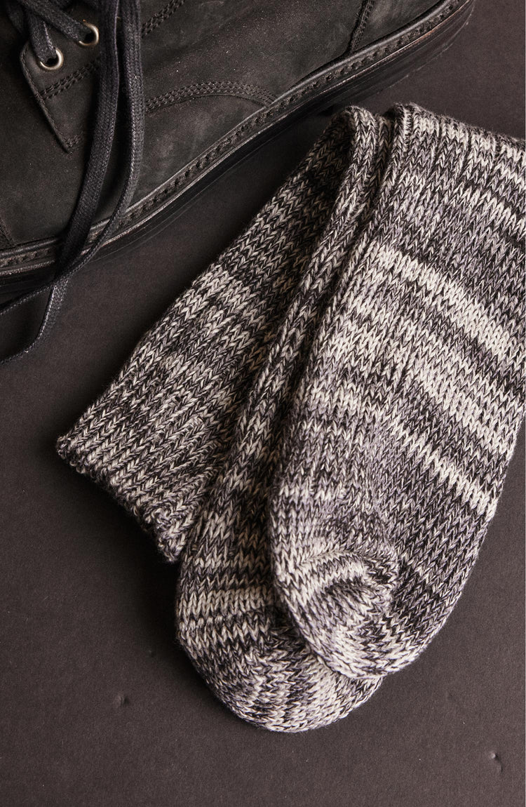editorial flatlay of The Camp Sock in Marled Blue next to a pair of shoes