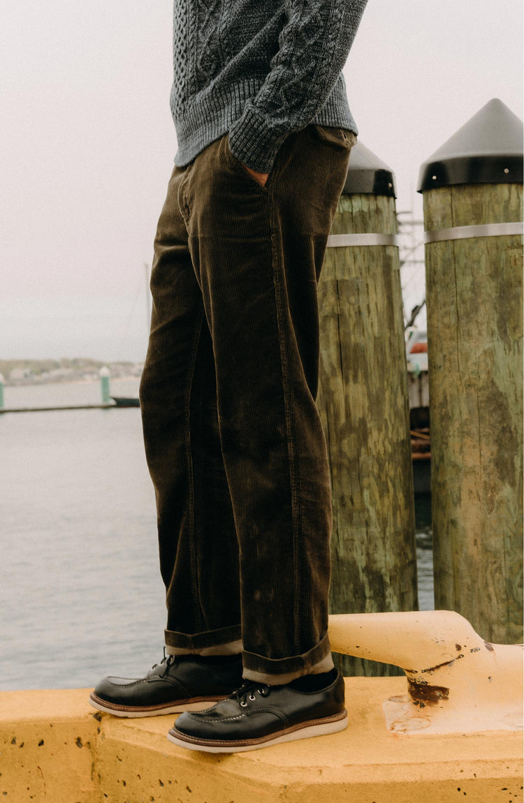 fit model posing in The Carnegie Pant in Fatigue Olive Corduroy