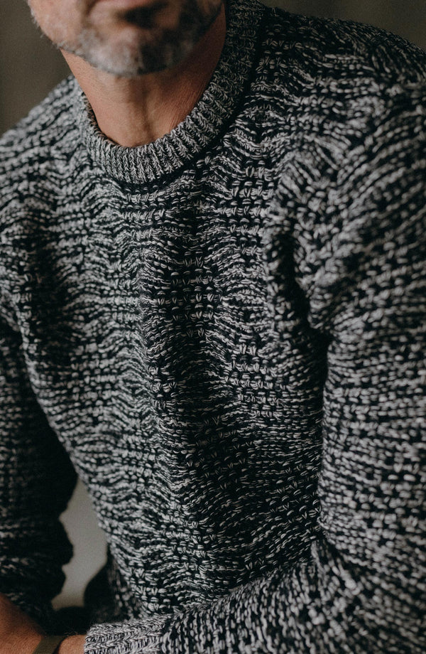 fit model sitting wearing The Chatham Crew in Marine Stripe Jacquard