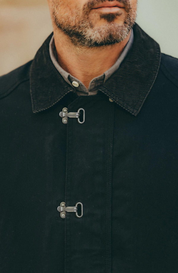 fit model showing off the collar on The Cinder Jacket in Coal Dry Wax