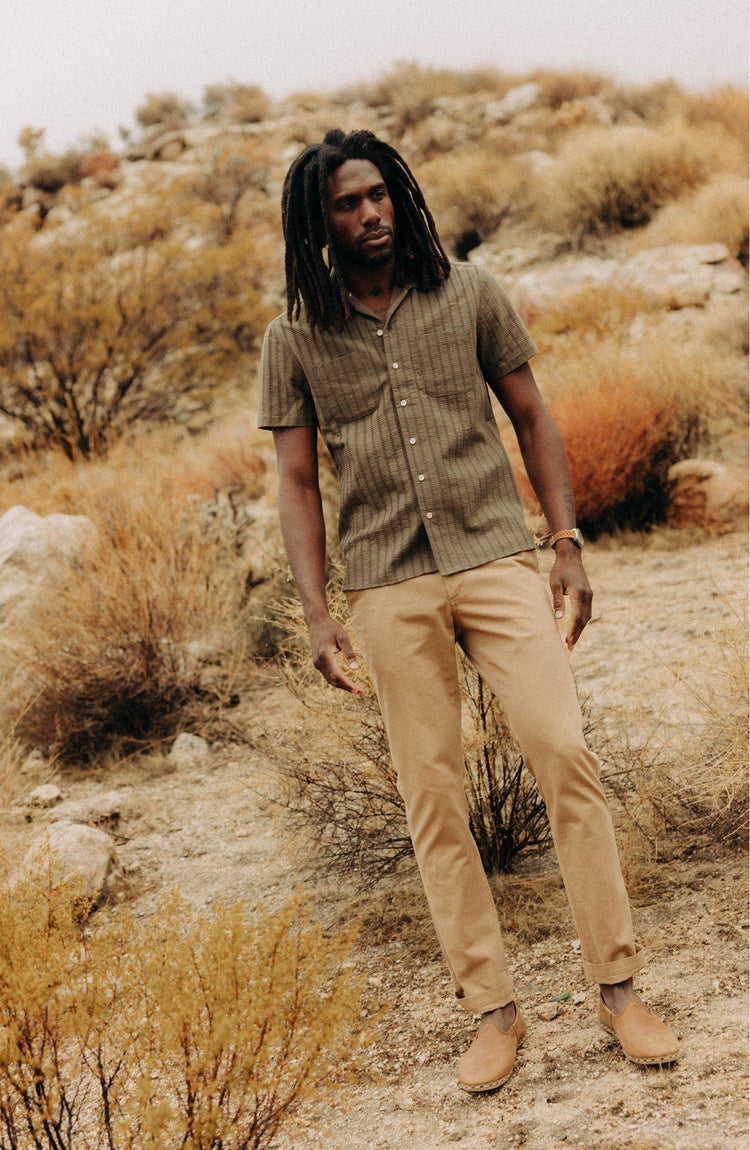 fit model posing in The Conrad Shirt in Fatigue Olive Dobby Stripe