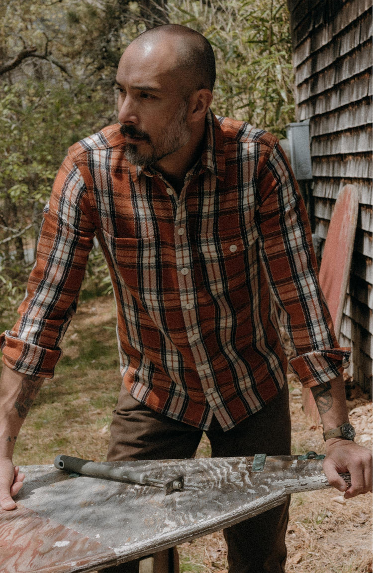 fit model posing in The Crater Shirt in Brick Plaid