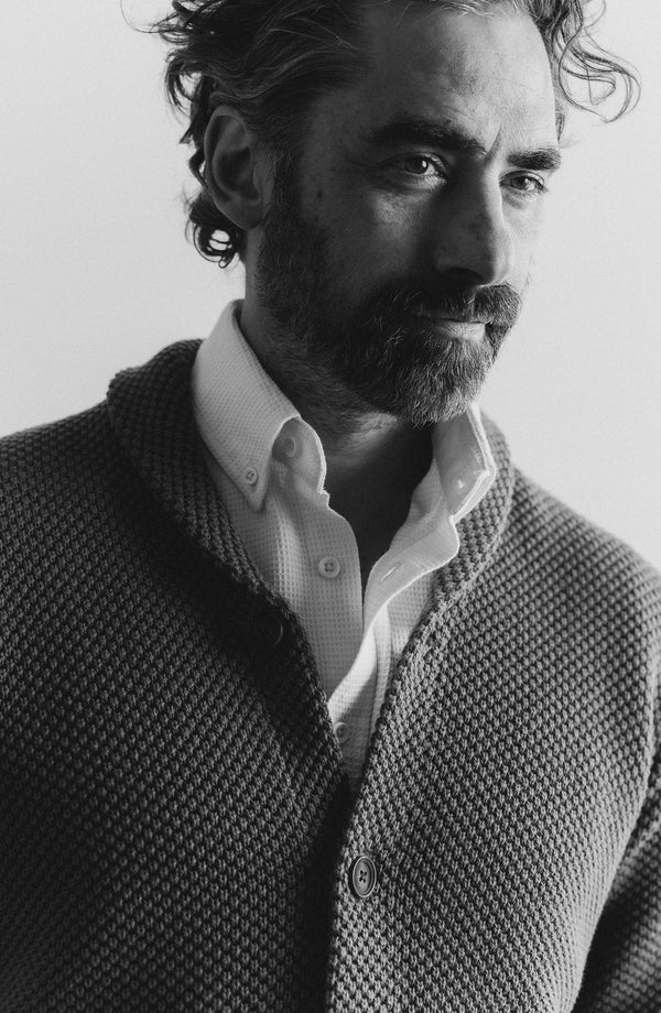 material shot of The Crawford Sweater in Fatigue Olive on a chair