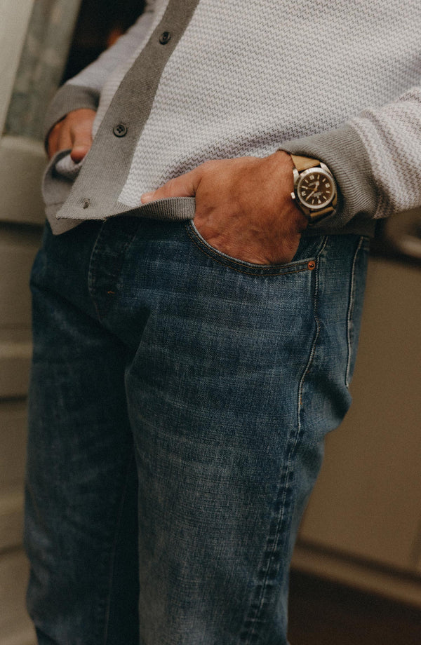 fit model showing off The Democratic Jean in Mid Wash Organic Selvedge