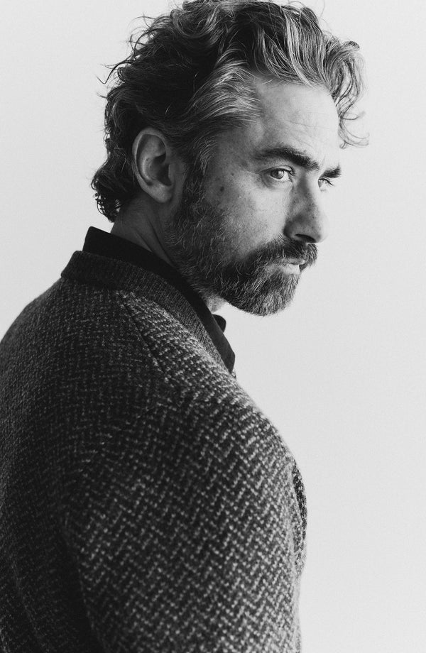 fit model showing off the shoulders on The Eddy Cardigan in Heather Charcoal Herringbone