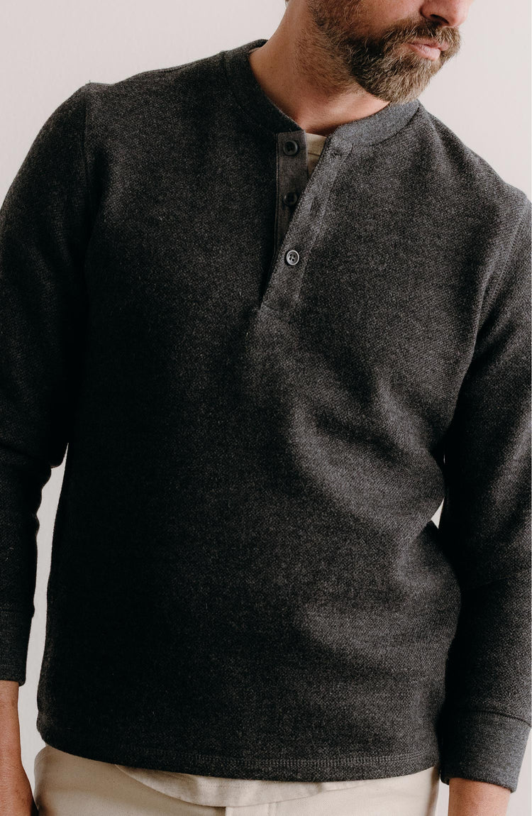 fit model posing in The Evans Henley in Charcoal Birdseye Wool