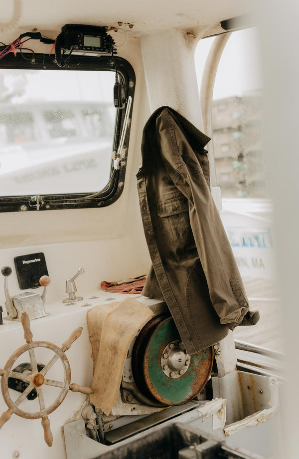 editorial image of The Field Overshirt in Mushroom Ripstop in a boat