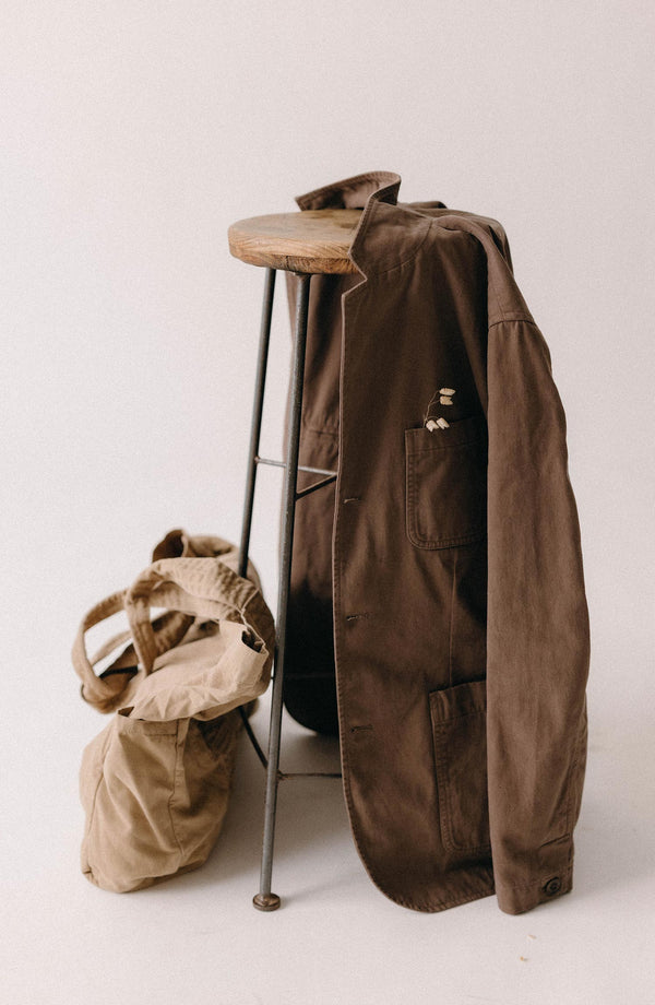 editorial image of The Foundation Sportcoat in Organic Espresso Twill on a chair