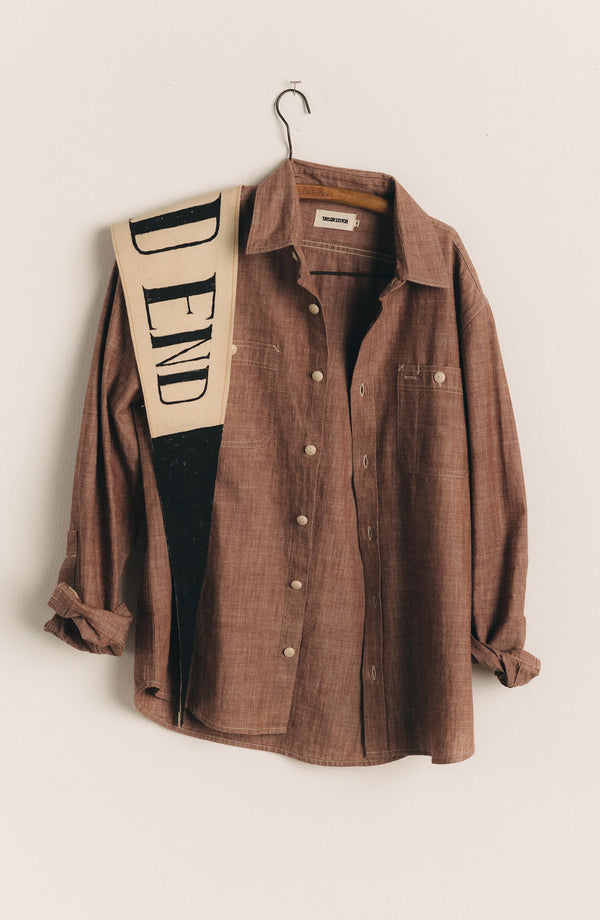 editorial image of The Foundry Shirt in Brick Chambray hanging