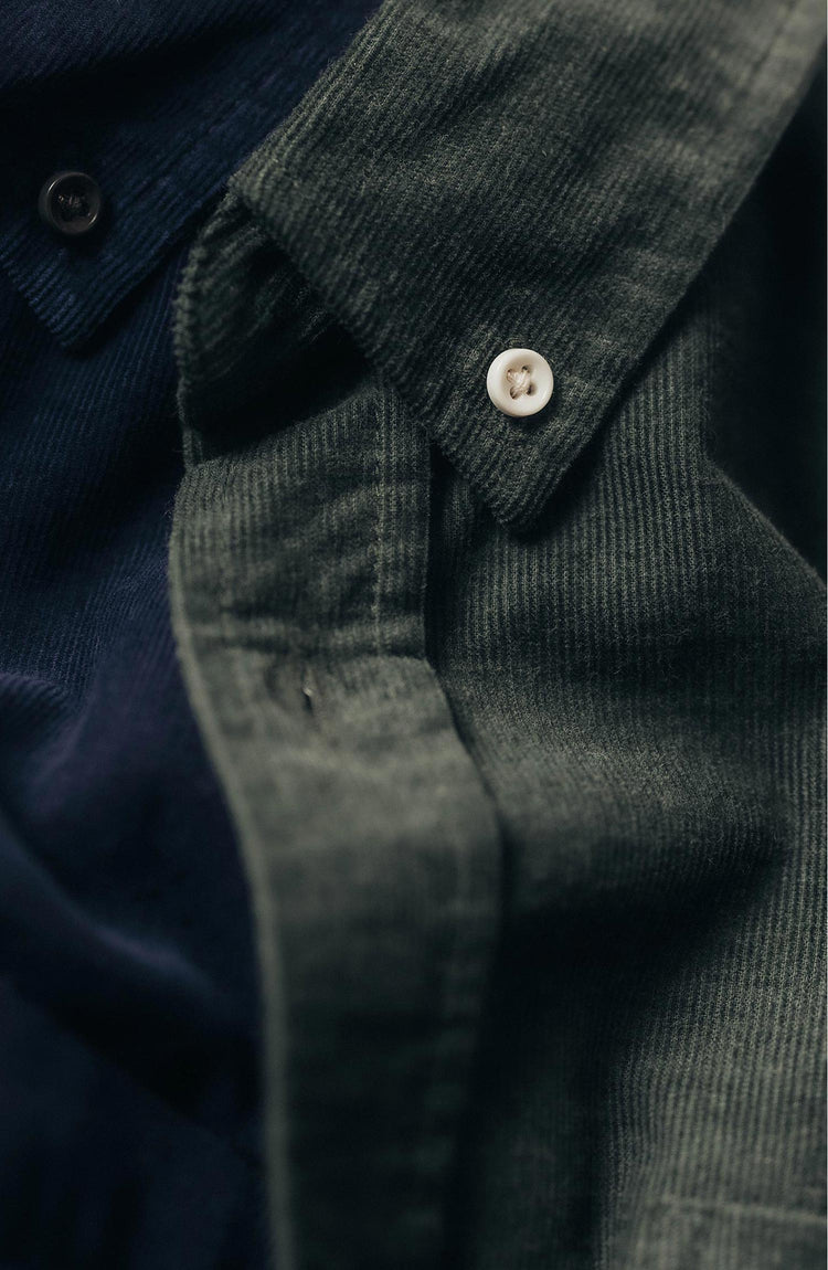 fit model leaning against a pole wearing The Jack in Heather Pine Pincord