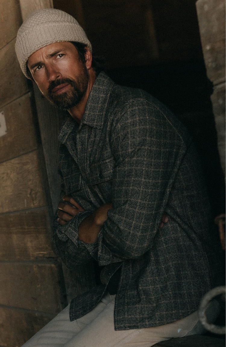 fit model posing in The Ledge Shirt in Coal Plaid