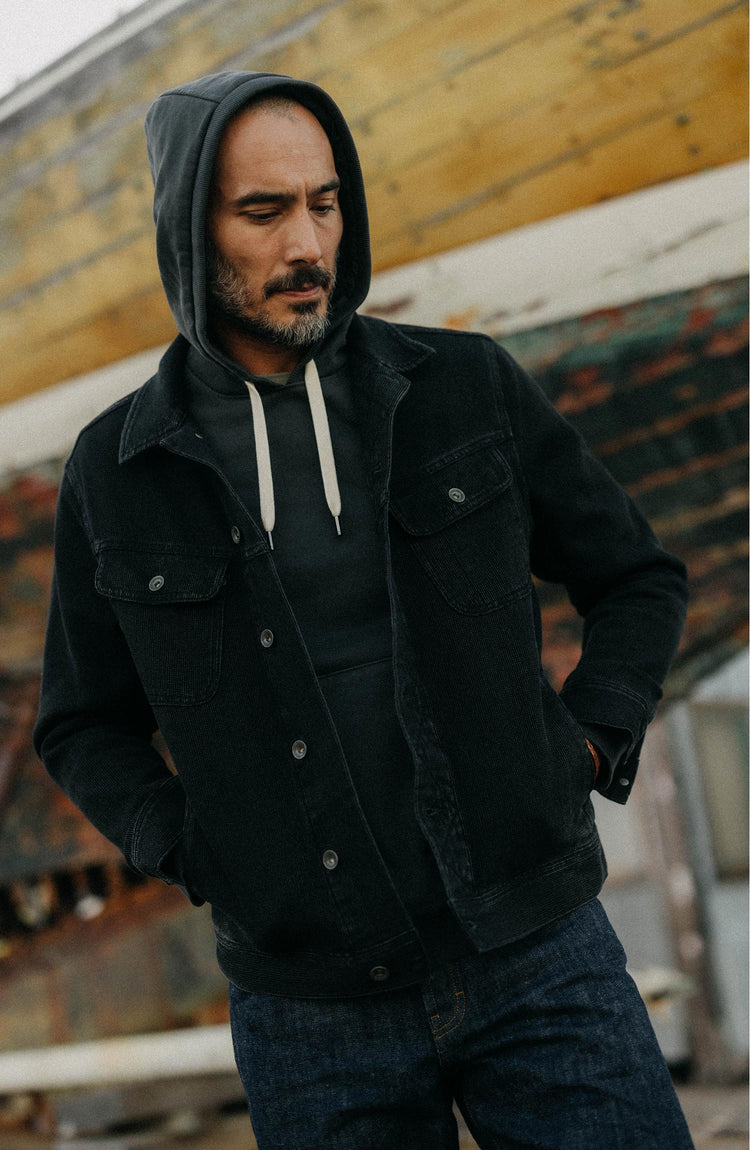 fit model posing in The Long Haul Jacket in Black Indigo Waffle