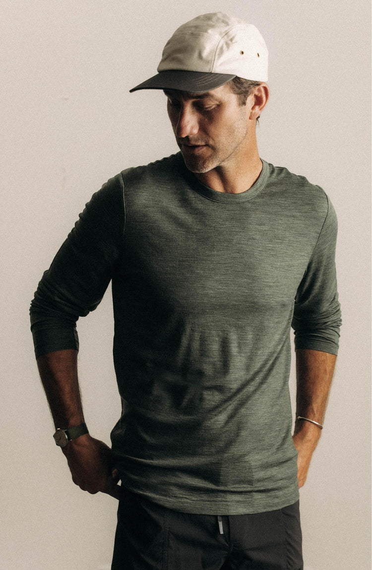 fit model showing off The Merino Long Sleeve Tee in Heather Army
