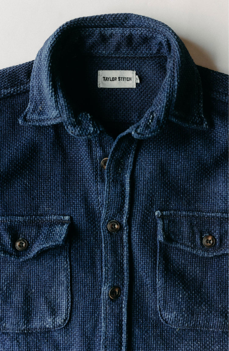editorial flatlay of The Mill Shirt Jacket in Rigid Indigo Sashiko
